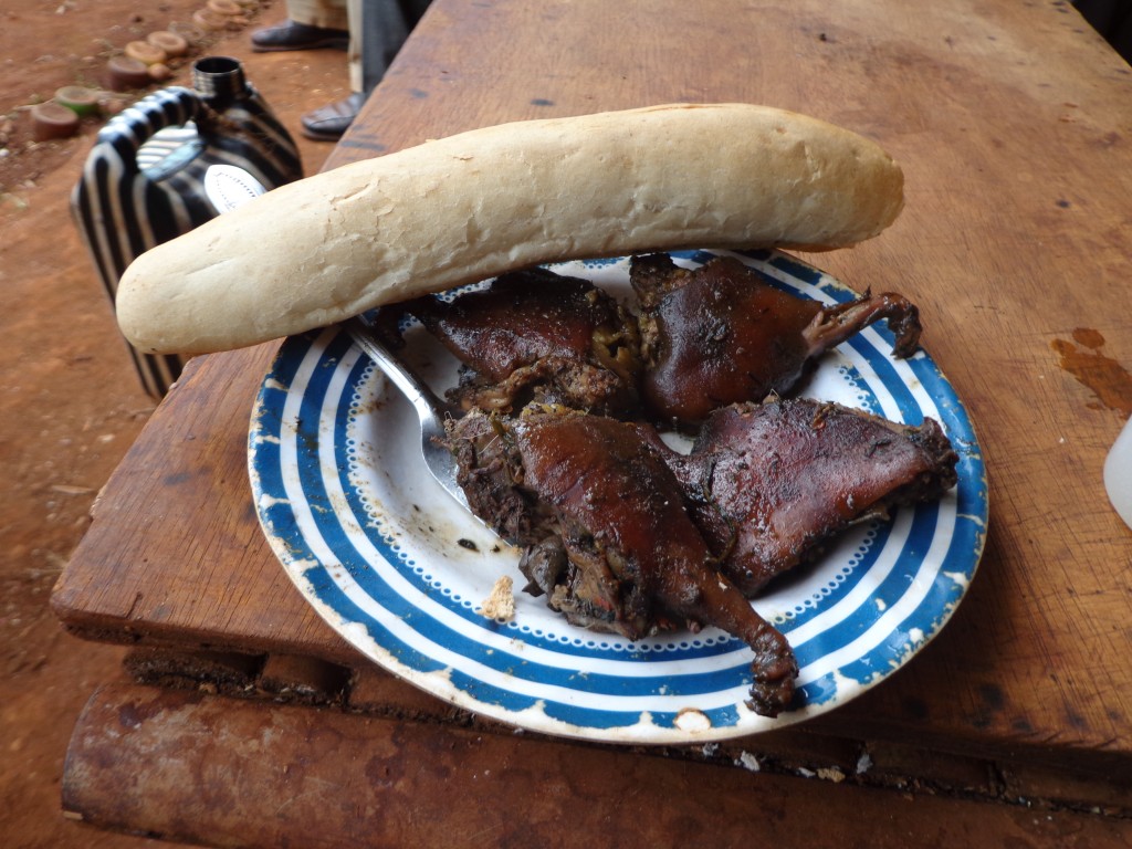 A meal of roast cavy served with bread in West Cameroon
