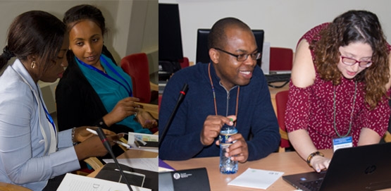 'Advanced cereals genetics research' workshop participants Christal Toge from Nigeria and Tsion Fikre from Ethiopia in discussions, while JIC trainers Oluwaseyi Shorinola and Pilar Corredor-Moreno set up training materials (photo: BecA-ILRI Hub\Ethel Makila).